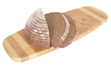 The rye bread on the chopping board isolated.