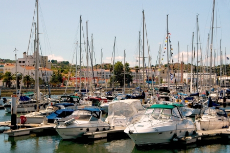 The yacht harbour of Lagos has a more modern atmosphere  Lined by shops, cafes and restaurants it is a wonderful place to lean back with a drink and to observe the activity のeditorial素材