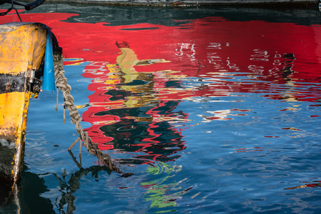 Reflection of boats on waterの写真素材