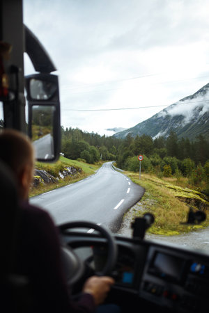 Norway road landscape on high mountains. Photo of the road among the mountains from the bus window.の写真素材