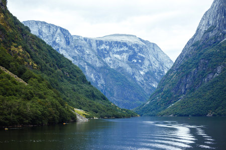 Picturesque landscape mountains of Norway. Beautiful view of the lake. Rocky shore of mountain lake.の写真素材