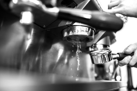 Coffee being prepared with an espresso machineの写真素材