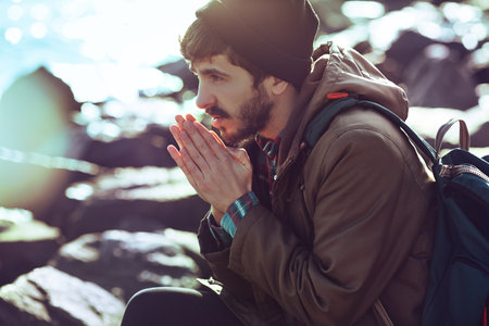 Outdoor Portrait of a handsome brutal bearded man with dark beard.の写真素材