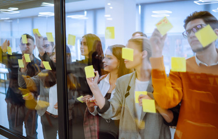 Young business team people brainstorm on corporate project together write strategy tasks.の写真素材