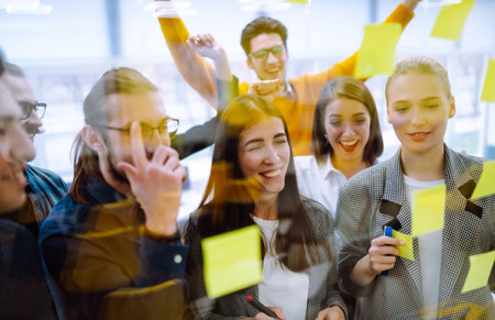 Young business people demonstrating unity with their own hands.