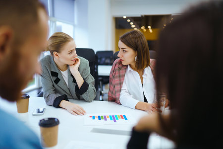 Group of young businesspeople working together in creative office. Planning, analysis, collaboration.の写真素材