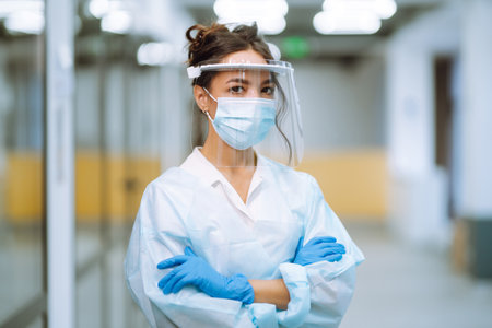 Disease control expert with an Infrared thermometer equipment to check the temperature at office.の写真素材