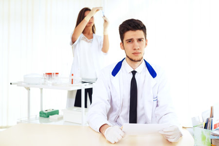 group of scientists working at the laboratory laboratory concept with caucasian male chemist.の写真素材