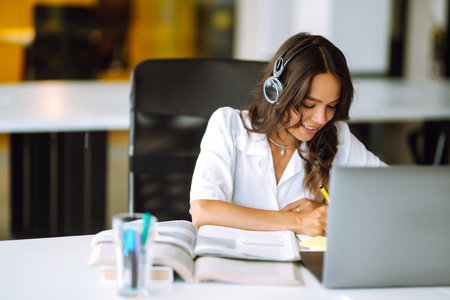 Young operator woman agent with headsets working in a call centre. call center service.の写真素材