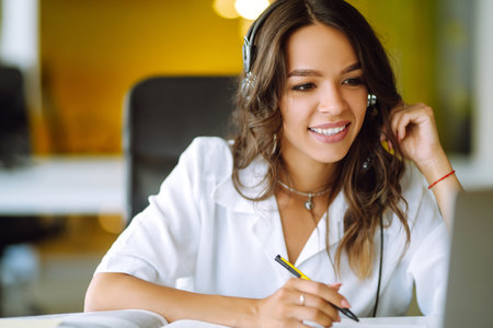 Young operator woman agent with headsets working in a call centre. call center service.の写真素材