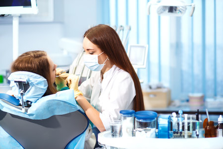 Professional woman dentist doctor working. woman at dental clinic. lady woman at dentist taking care of teeth.の写真素材