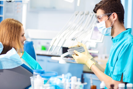 Overview of dental caries prevention. Woman at the dentist's chair during a dental procedure. Healthy Smile.の写真素材