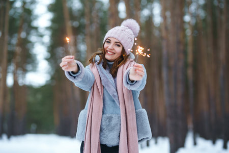 Christmas wreath in beautiful woman hands in snow forest. seasonal holidays, adorning. Christmas.の写真素材