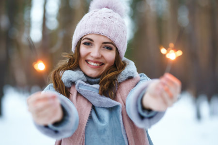 Christmas wreath in beautiful woman hands in snow forest. seasonal holidays, adorning. Christmas.の写真素材