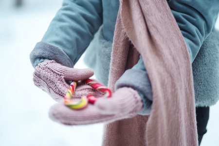 Christmas wreath in beautiful woman hands in snow forest. seasonal holidays, adorning. Christmas.の写真素材