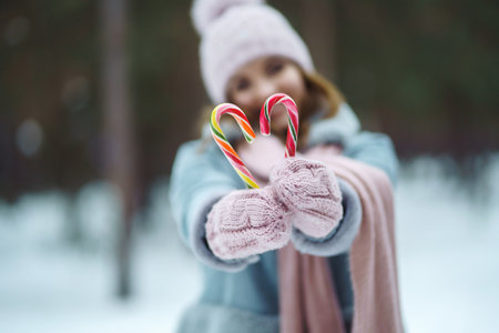 Christmas wreath in beautiful woman hands in snow forest. seasonal holidays, adorning. Christmas.の写真素材