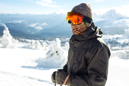 Man skiing in the mountains. Skiing in the snowy mountains, Winter is coming, snowfall. active lifestyle.の写真素材
