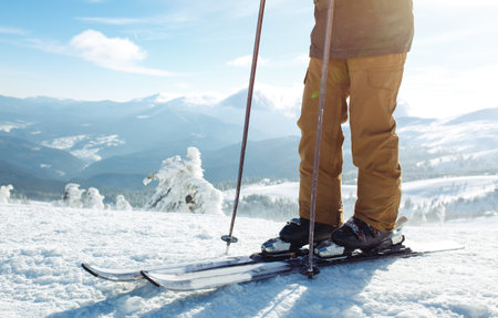 Man skiing in the mountains. Skiing in the snowy mountains, Winter is coming, snowfall. active lifestyle.の写真素材