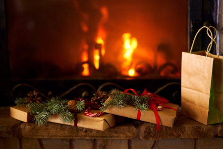 New Year or Christmas Gift Box with Red Ribbon. fireplace backgroundの写真素材