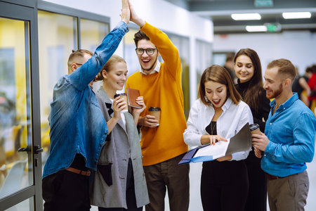 Group of young businesspeople working together in creative office.の写真素材
