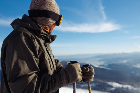 Man skiing in the mountains. Skiing in the snowy mountains, Winter is coming, snowfall. active...