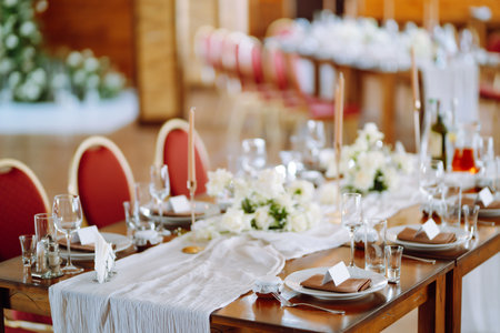 Beautiful table setting for a party, wedding reception or other festive event. Banquet setting, glasses, plates.の写真素材