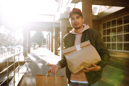 ?ourier delivers a bag of food in quarantine city. delivery service concept. Covid-2019.