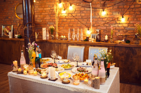 Beautiful table setting with crockery and flowers for a party, wedding reception or other event.