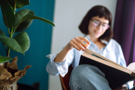 Close up of females hands on the keyboard. Young female freelancer working at home using laptop.