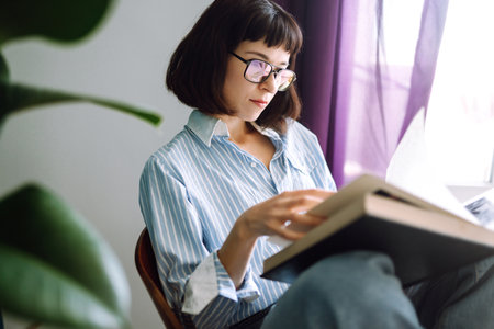 Close up of females hands on the keyboard. Young female freelancer working at home using laptop.