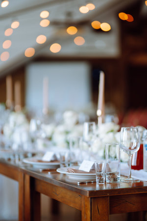 Beautiful table setting for a party, wedding reception or other festive event. Banquet setting, glasses, plates.の写真素材