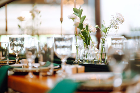 Floral decorations on the banquet table in the restaurant. Wedding, birthday, party, event concept.の写真素材