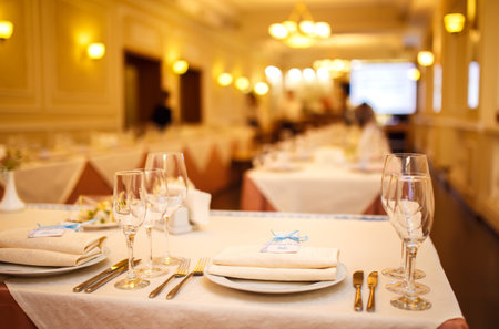 Beautiful table setting with crockery and flowers for a party, wedding reception or other event.の写真素材