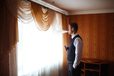 Luxury groom in suit. businessman. Morning Groom Fees. The beginning of the wedding day. Men's fashion.の写真素材