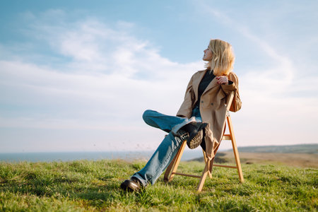 Young woman enjoys a spring sunny day. People, lifestyle, travel, nature and vacations concept.