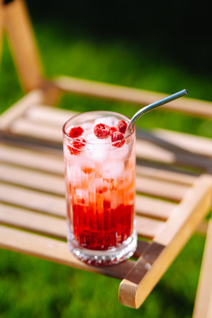 Alcoholic and non-alcoholic summer drinks with ice cubes of lemon, lime, fruits and mint. holiday.の写真素材