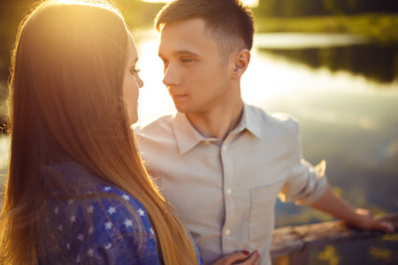 Couple in love enjoying tender moments during sunset.の写真素材