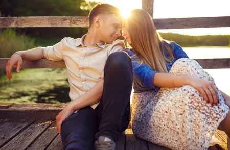 Couple in love enjoying tender moments during sunset.の写真素材
