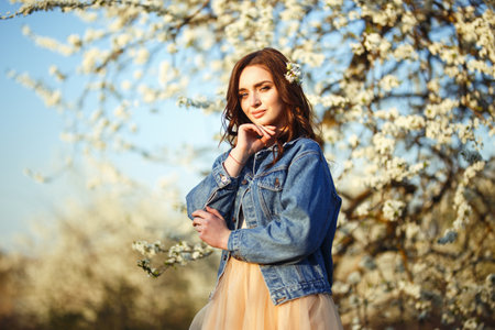Portrait of a beautiful bride. wedding concept. Stylish wedding. Great sunset light. spring garden.の写真素材