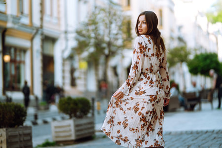 Summer girl in the city at sunset. People, freedom, lifestyle, travel and vacations concept.の写真素材