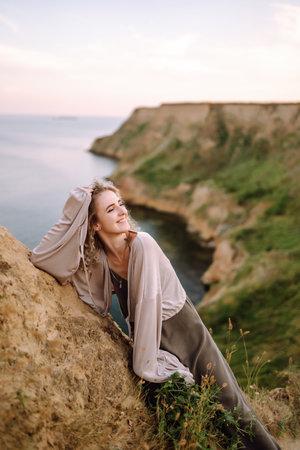 Young woman resting in nature. People, lifestyle, relaxation and vacations concept. fashion.の写真素材