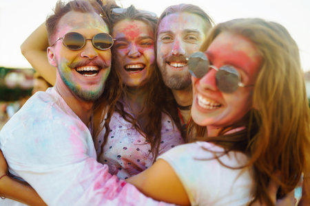 Teenagers Friends have fun at the holi festival. beach party. Celebrating traditional Indian spring holiday.の写真素材