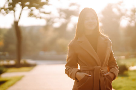 Pretty woman with smartphone having a good time in autumn weekend. People lifestyle concept.の写真素材