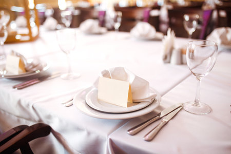 Banquet table with wedding and festive serving.Table covered with a tablecloth and served with dishes.の写真素材