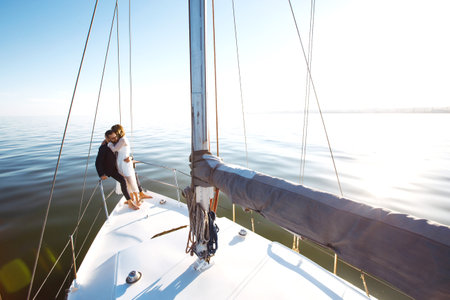 Beautiful wedding couple on yacht at wedding day outdoors in the sea. Together. wedding day.の写真素材