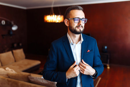 Elegant groom in suit. businessman. Portrait of the luxury groom in a jacket. wedding day.の写真素材