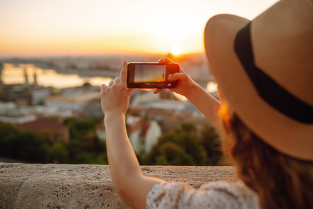 Travel Europe. Young woman enjoy sunrise. The concept of travel, tourism, vacation and freedom.の写真素材