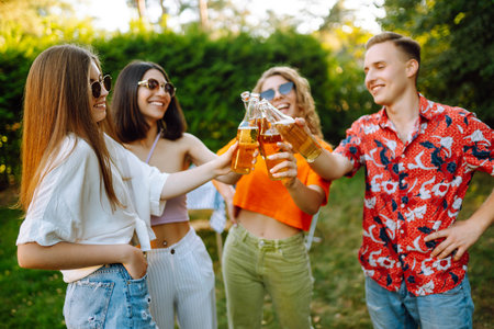 ?ompany of people having bbq party on in summer park. Friends grill meat, relax. Picnic and barbecueの写真素材