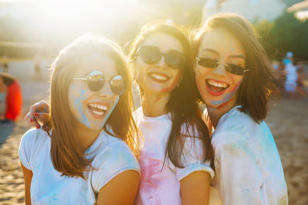 A group of friends have fun, dance at holi festival. Friendship, Leisure, Vacation, Togetherness.の写真素材