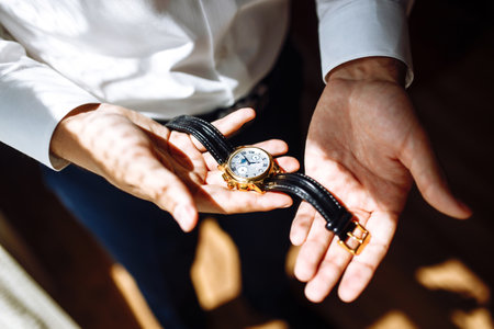 Stylish men's wrist watch, the man is watching the time. . Businessman checking time on his wristwatch.の写真素材